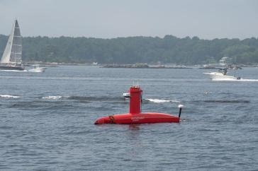 A red autonomous surface vessel called Drix in Portsmouth Harbor